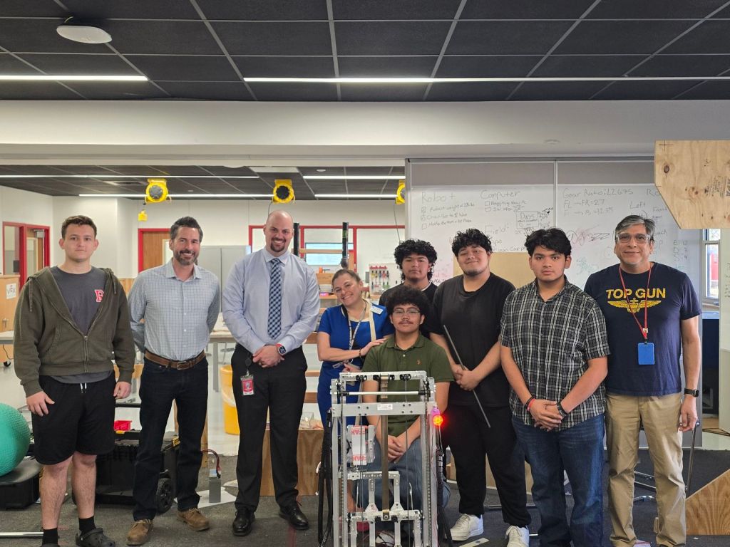 Sandi with Robotics students, district leadership, and vendor contact